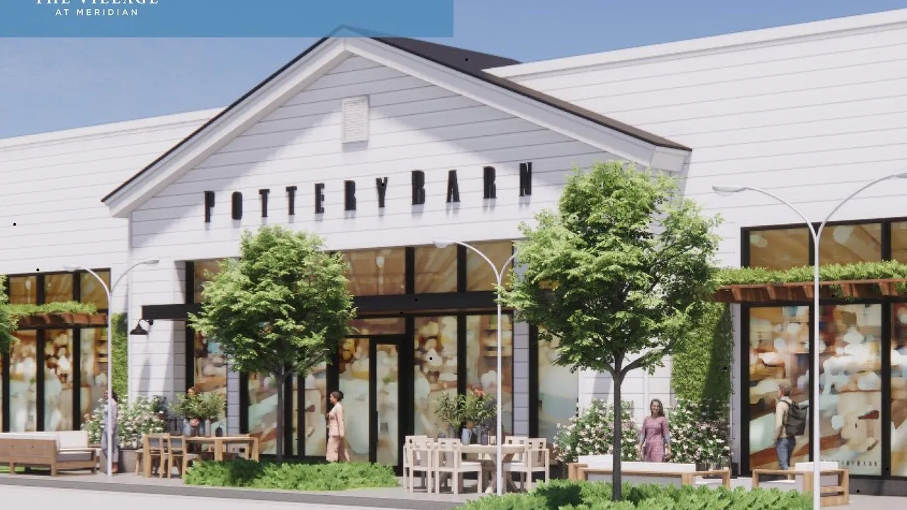 Artist's rendering of a white Pottery Barn store with trees, outdoor furniture and pedestrians.