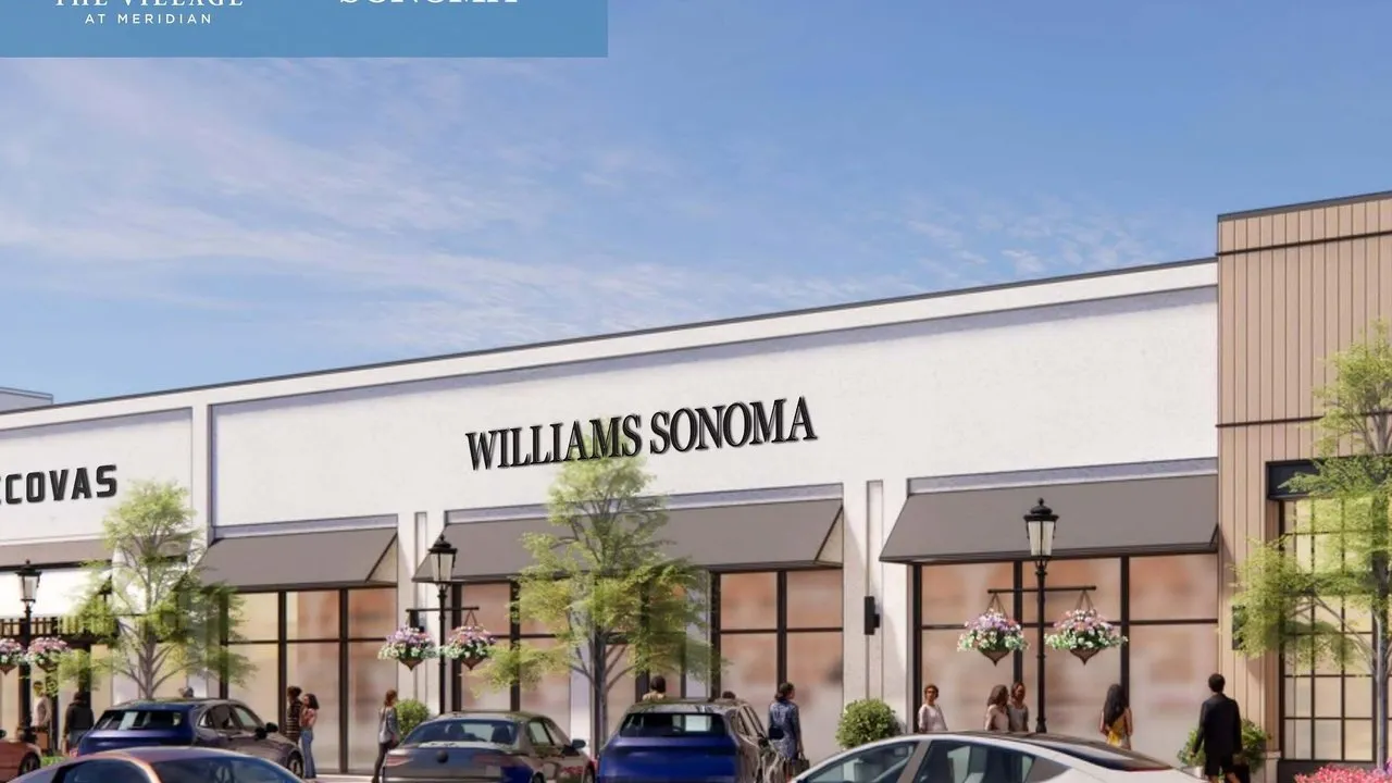 Artist's rendering of a Williams Sonoma storefront at an outdoor shopping centre with cars and pedestrians outside.