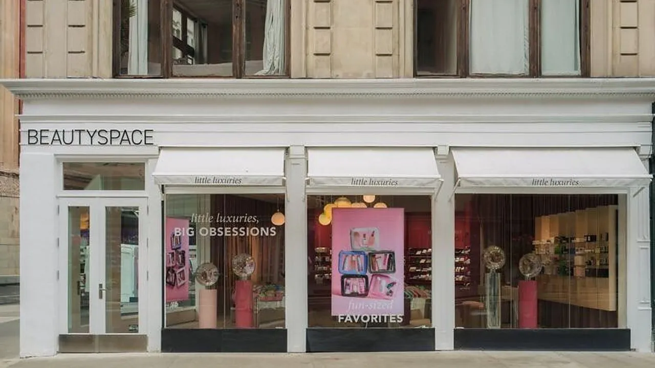 Beautyspace storefront with white awnings and pink Little Luxuries window displays